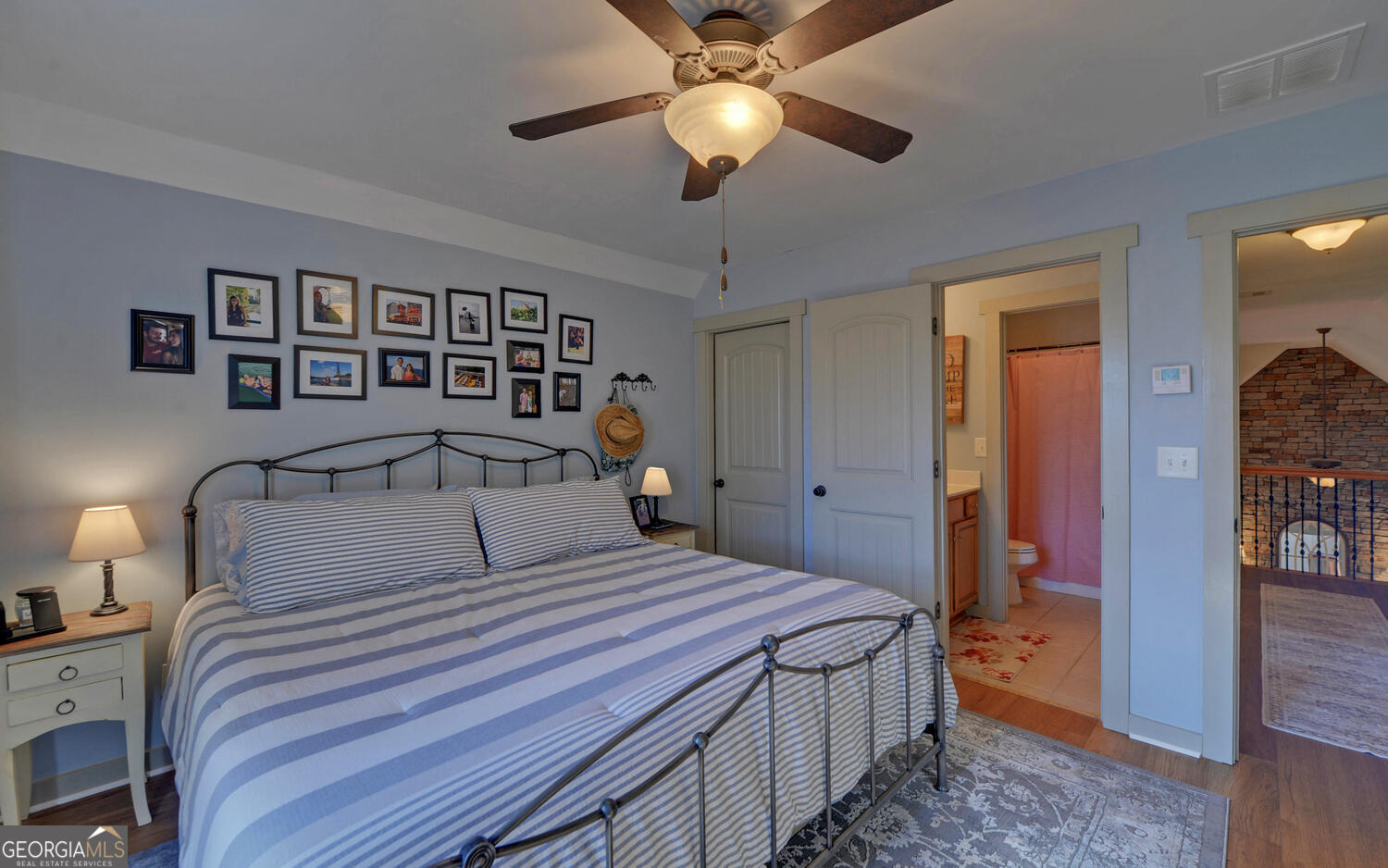 819 Tranquility Lane Hartwell, GA 30643 - Photo 35 of 81 a bedroom with a large bed and a chandelier