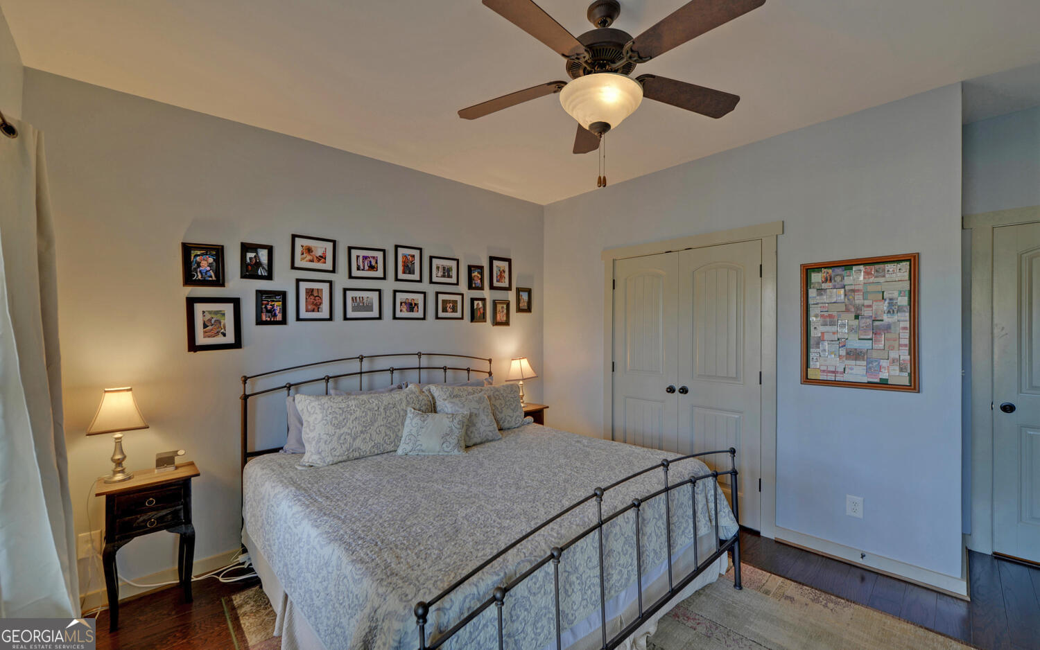 819 Tranquility Lane Hartwell, GA 30643 - Photo 53 of 81 a bedroom with a bed and a chandelier