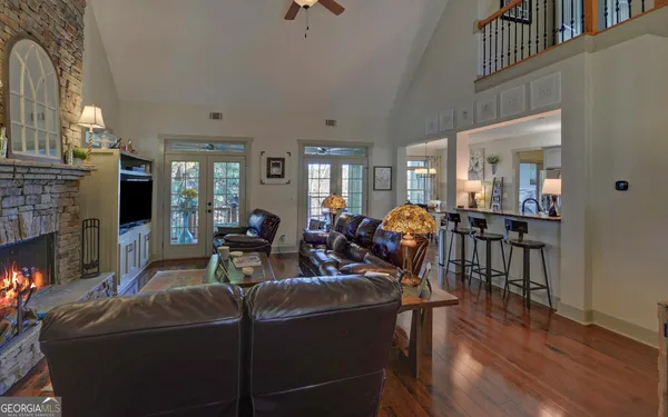 a view of living room with furniture and a fireplace