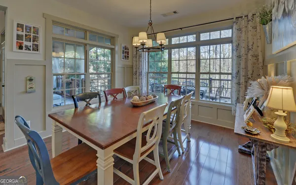 a kitchen with granite countertop a refrigerator and a stove top oven