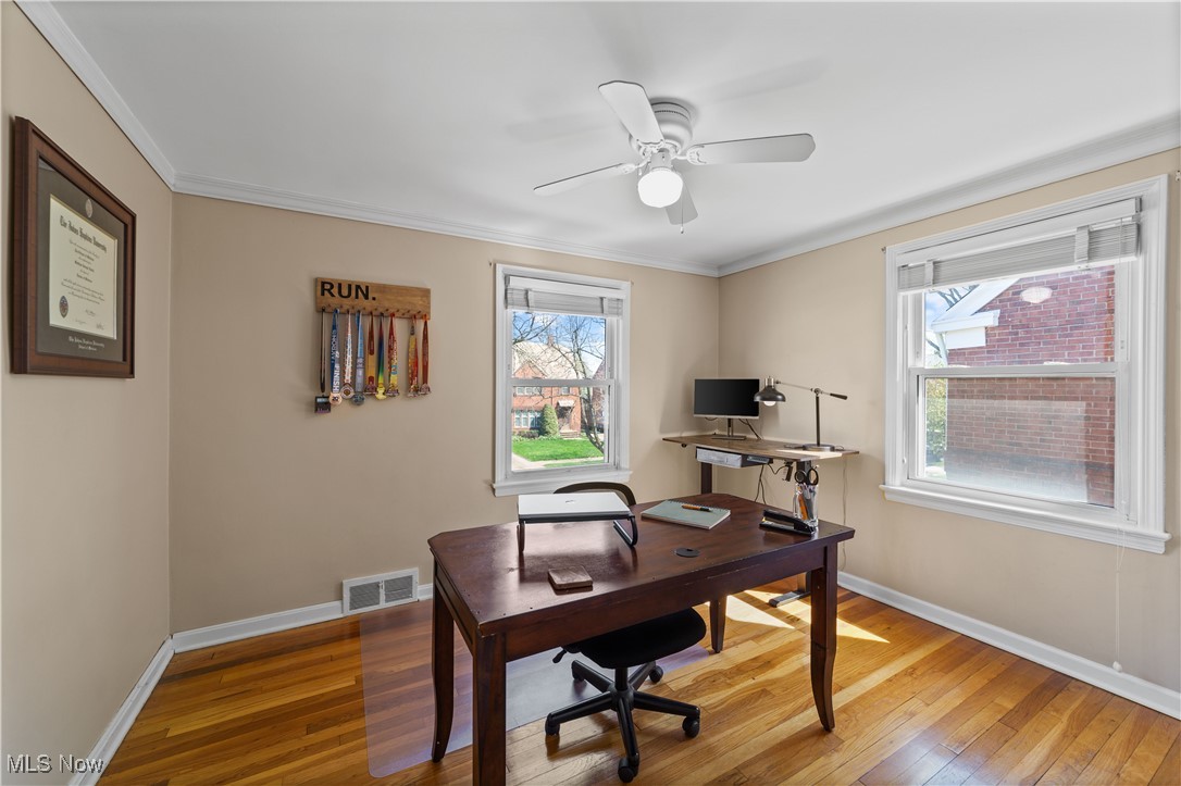 3826 Faversham Road Cleveland, OH 44118 - Photo 17 of 40 Office featuring a ceiling fan, light wood finished floors, baseboards, ornamental molding, and visible vents