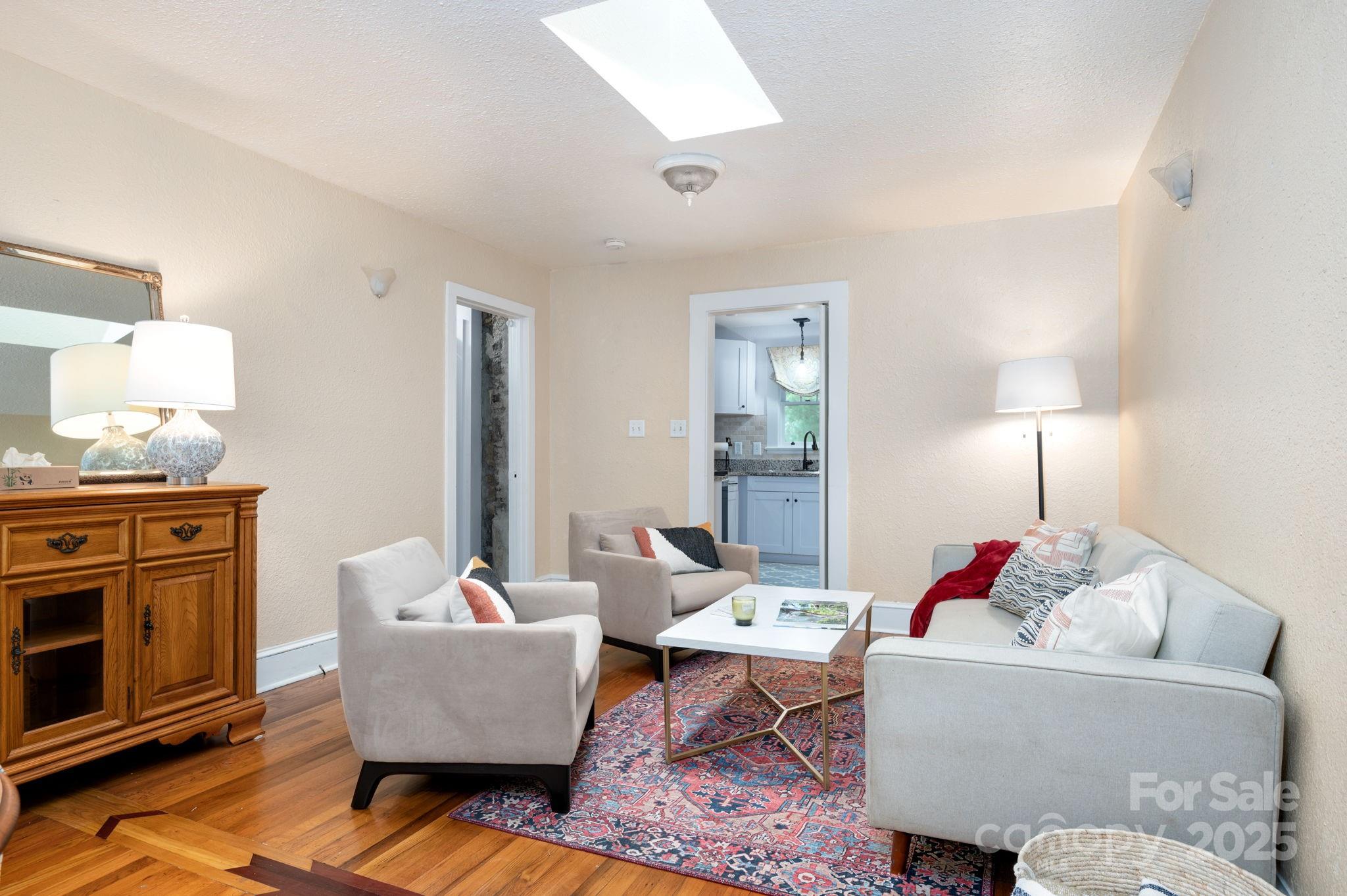 115 Oakland Road Asheville, NC 28801 - Photo 12 of 32 a living room with furniture and a fireplace