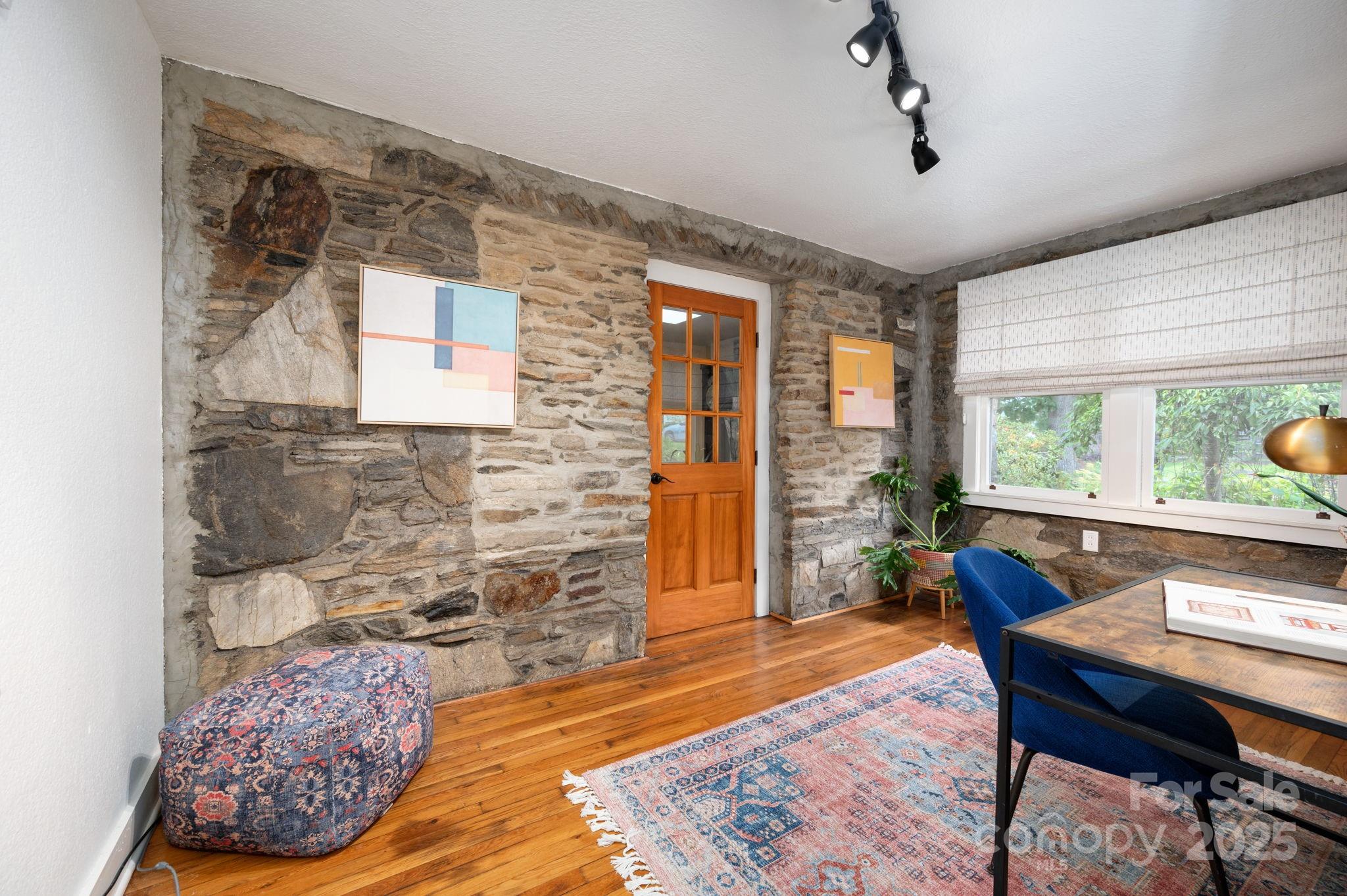 115 Oakland Road Asheville, NC 28801 - Photo 17 of 32 a living room with furniture and a rug