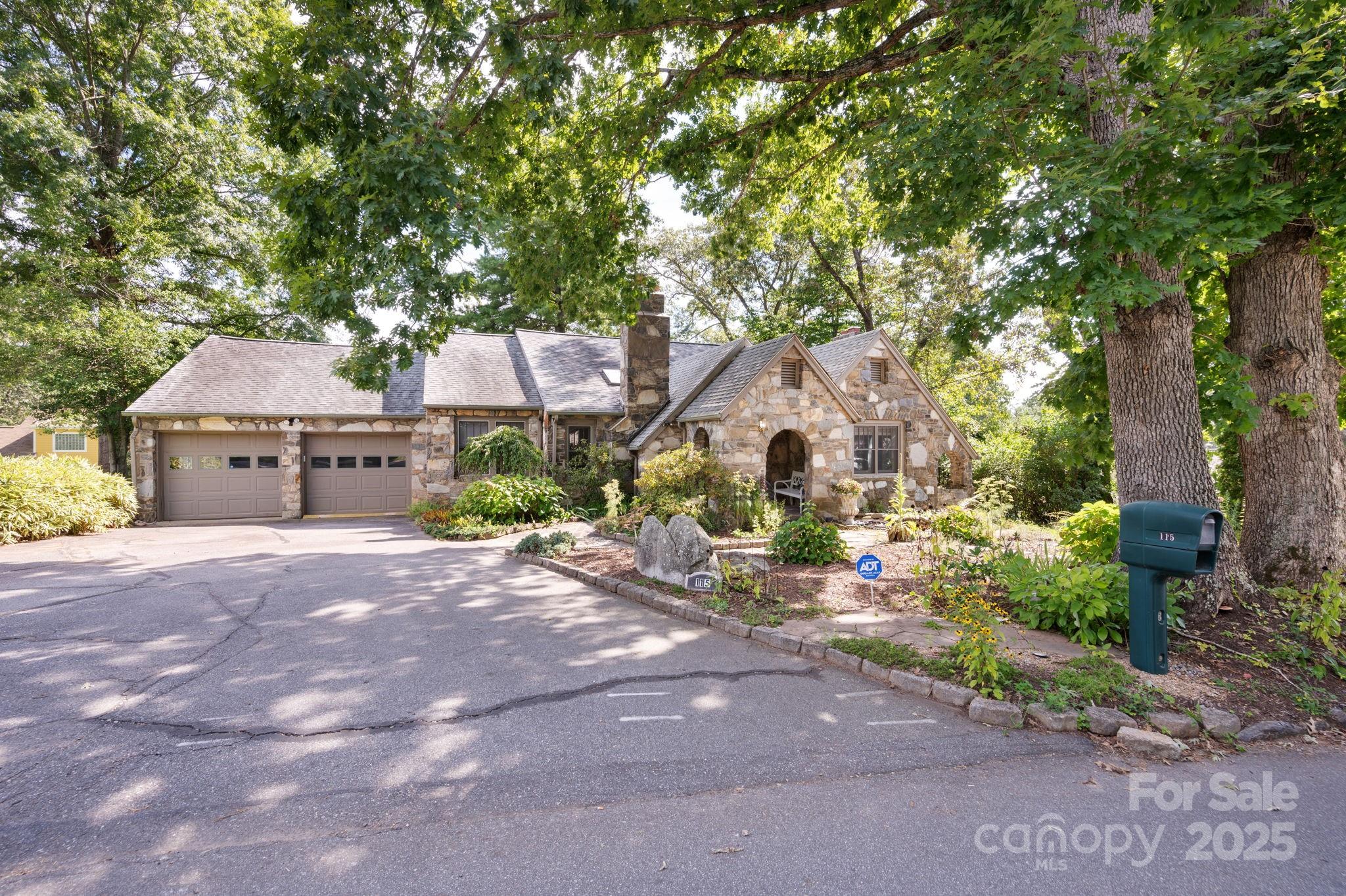 115 Oakland Road Asheville, NC 28801 - Photo 2 of 32 a front view of a house with garden