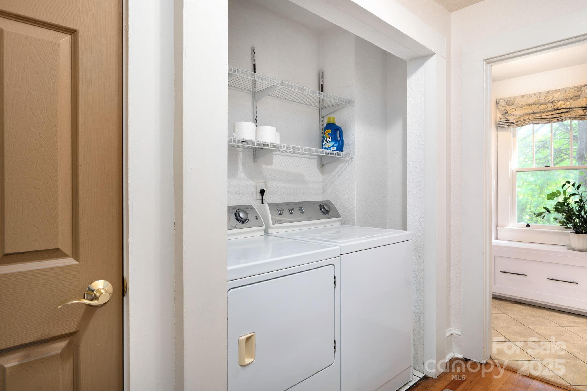 115 Oakland Road Asheville, NC 28801 - Photo 22 of 32 a view of storage and utility room with washer and dryer