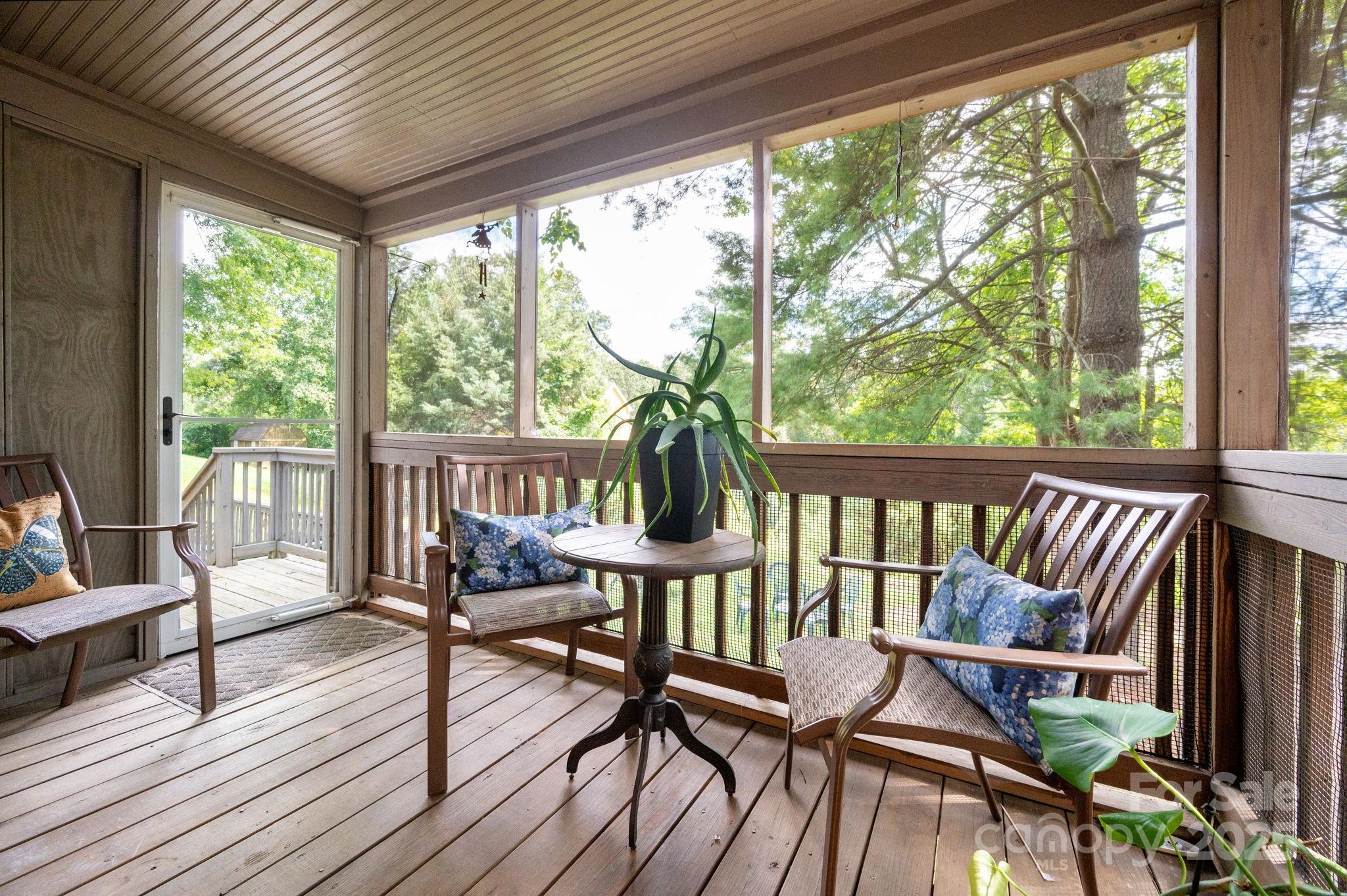 115 Oakland Road Asheville, NC 28801 - Photo 25 of 32 a view of a chairs on the deck