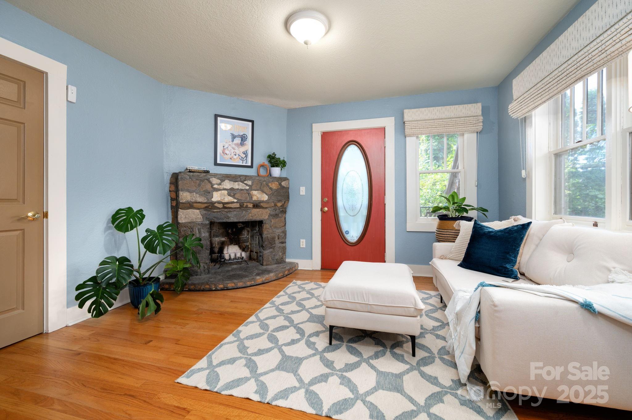 115 Oakland Road Asheville, NC 28801 - Photo 8 of 32 a living room with furniture and a fireplace