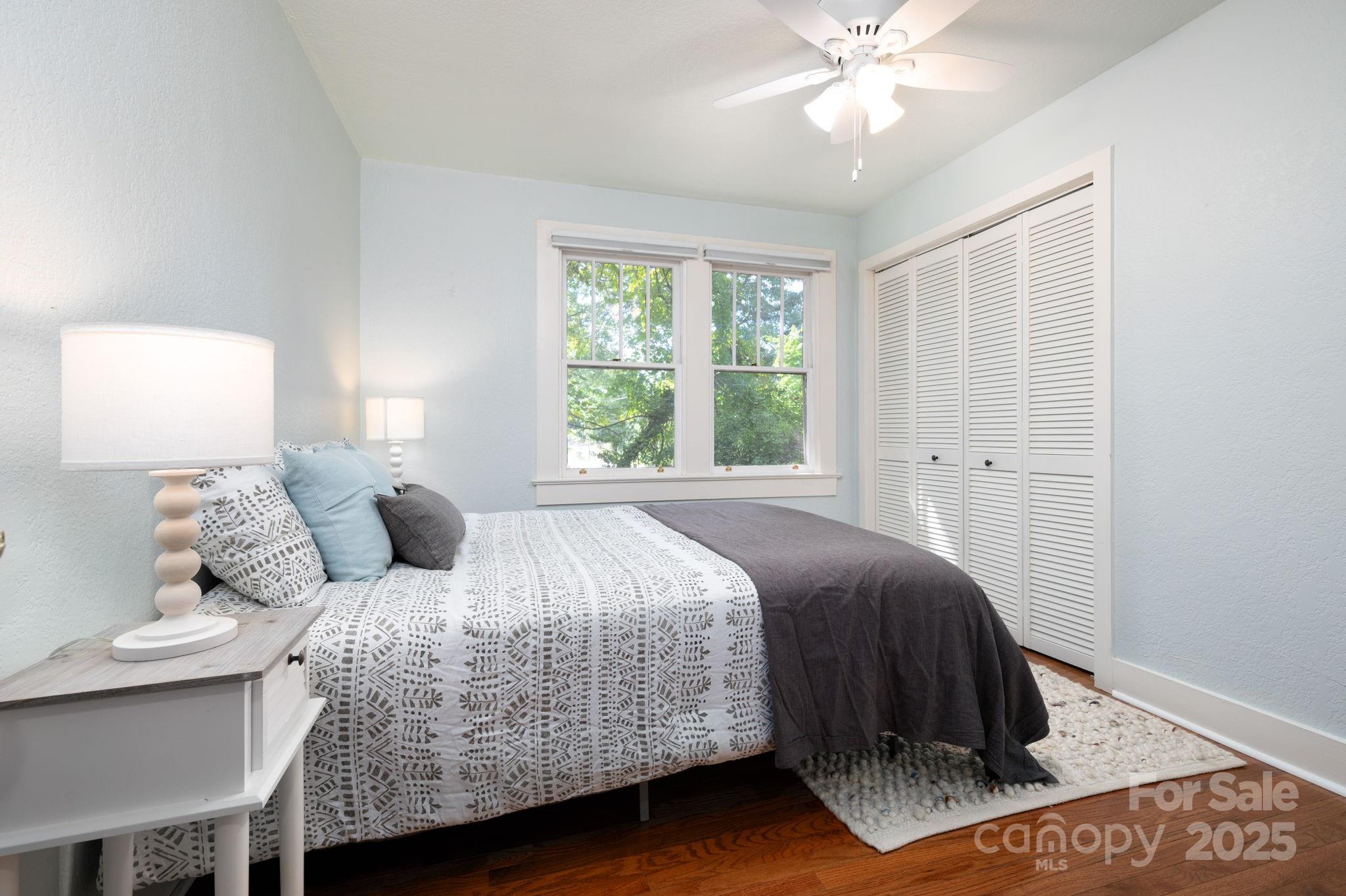 115 Oakland Road Asheville, NC 28801 - Photo 9 of 32 a bedroom with a bed and window