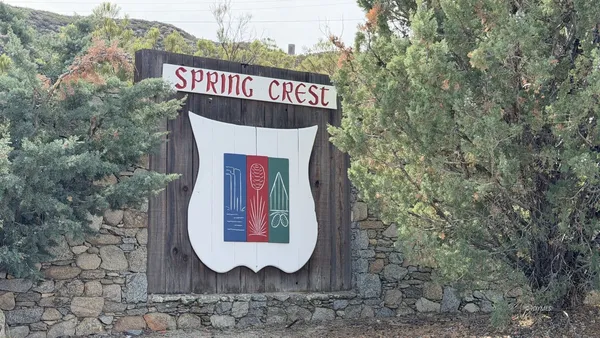 a view of a wooden house with a trees