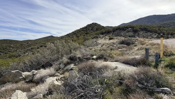 a view of a city with mountains in the background