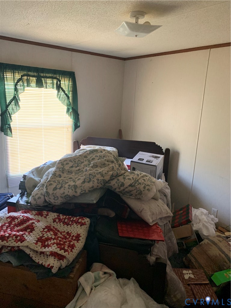 15532 Sandy Field Road Stony Creek, VA 23882 - Photo 19 of 20 a bedroom with a bed and a window