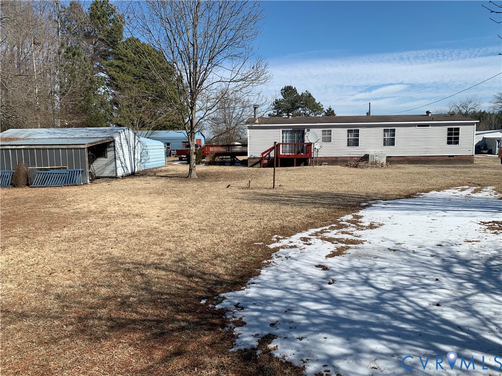 15532 Sandy Field Road Stony Creek, VA 23882 - Photo 7 of 20 a view of a yard with car parked