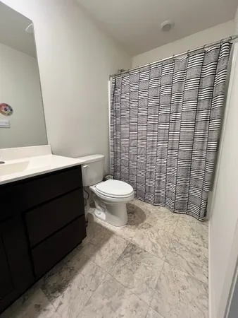 a bathroom with a toilet and a sink