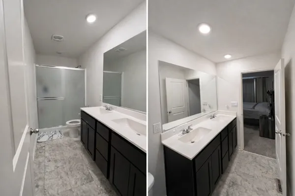 a bathroom with a double vanity sink and mirror