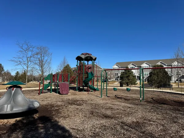 a view of a park with swings