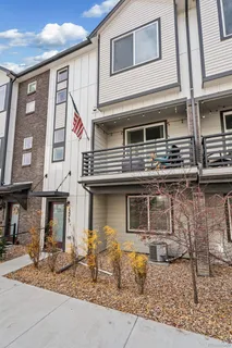 a front view of a house with many windows