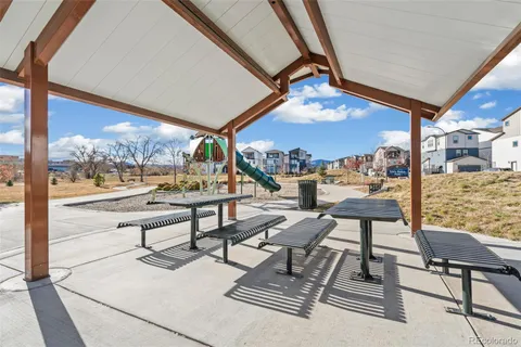 a view of a chairs and table in a patio