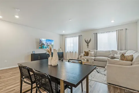 a living room with furniture and a table