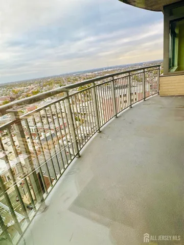 an empty room with wooden floor and closet