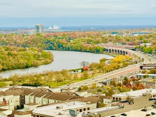 a view of a room with wooden floor and staircase