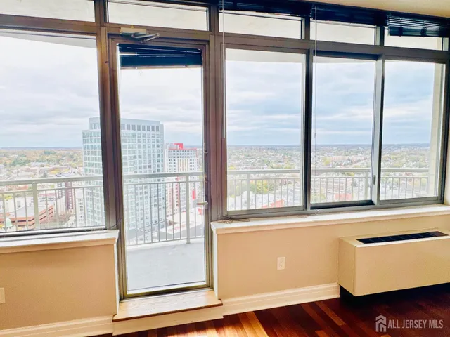 a kitchen with granite countertop a sink a stove and a refrigerator