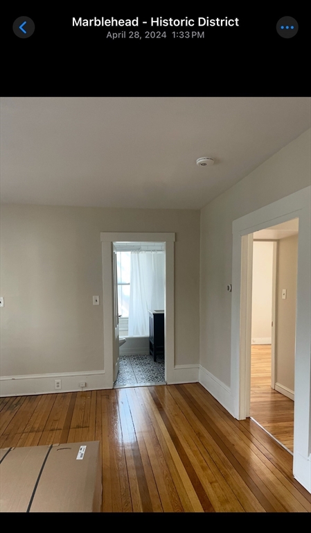 15 Harris Street, Unit 2 Marblehead, MA 01945 - Photo 7 of 12 a view of empty room with wooden floor
