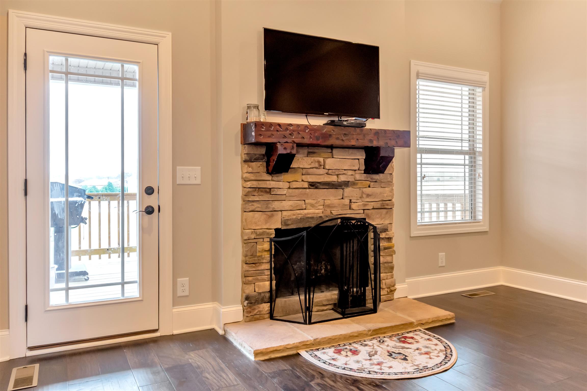 2935 Turner Road Watertown, TN 37184 - Photo 6 of 17 a living room with a fireplace and a flat screen tv