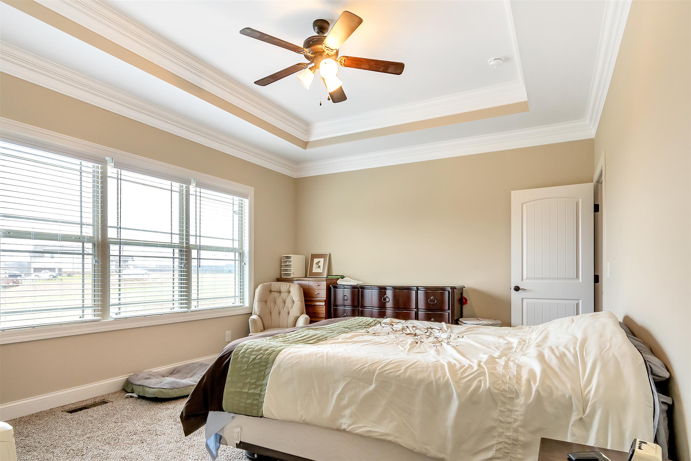 2935 Turner Road Watertown, TN 37184 - Photo 8 of 17 a bedroom with a large bed and a chandelier