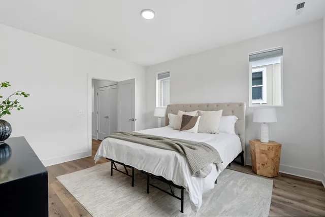 a bedroom with a bed and a table