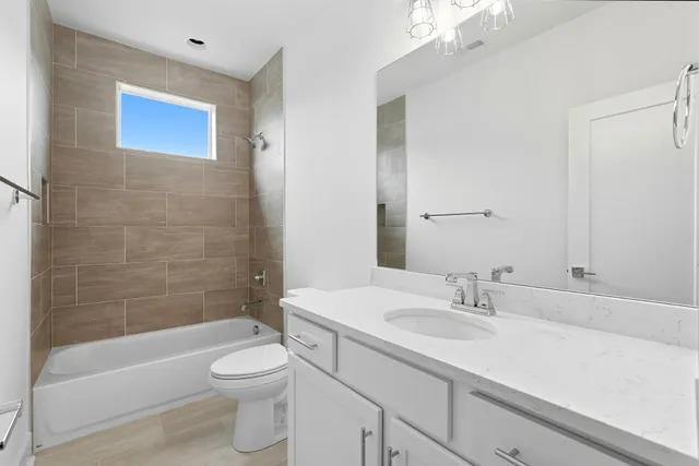 a bathroom with a sink a toilet and a bathtub