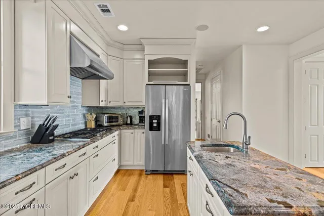 a bedroom with furniture and a fireplace