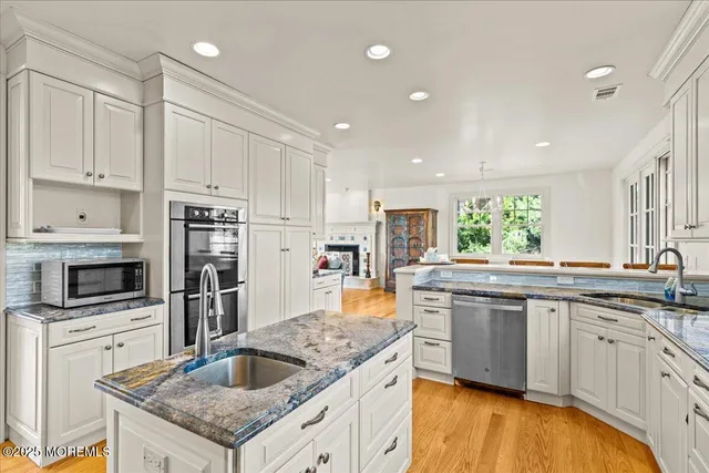 a bedroom with a bed lamp and window