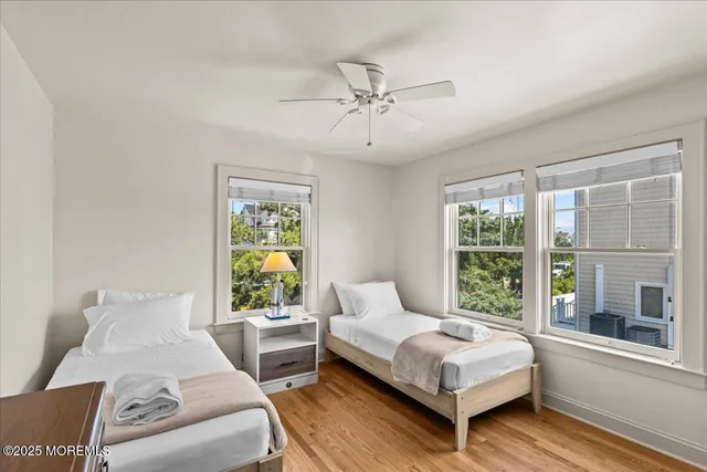 a bedroom with furniture and large window