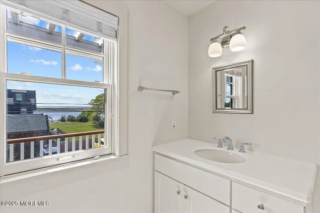 a spacious bedroom with a large bed and a large window