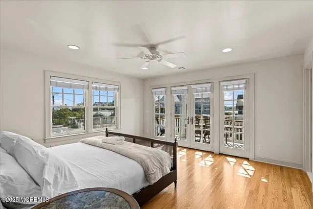 a view of a dining room with furniture a chandelier and wooden floor