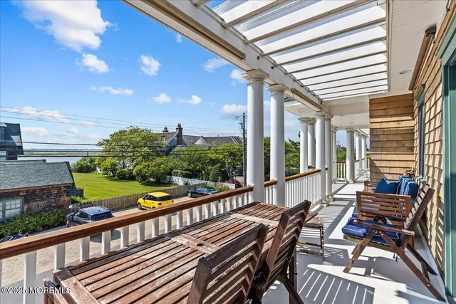 a bathroom with a shower sink mirror and toilet