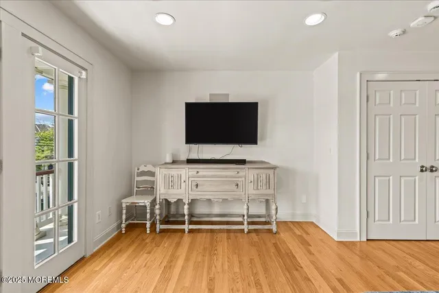 a bathroom with a granite countertop sink a toilet and a shower