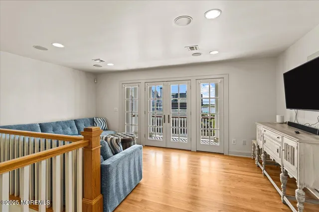a bedroom with a large bed and a large window
