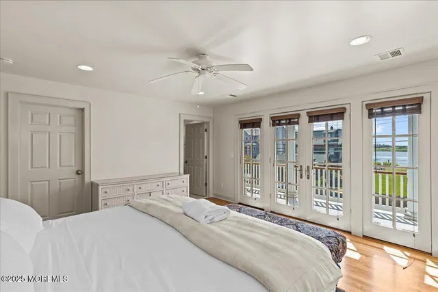 a bathroom with a shower a sink a toilet and mirror