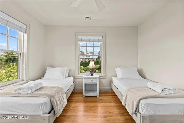 a view of a chairs and table on the wooden floor