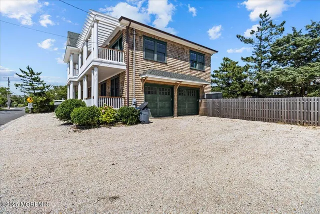 a view of a floor with wooden floor and iron stairs