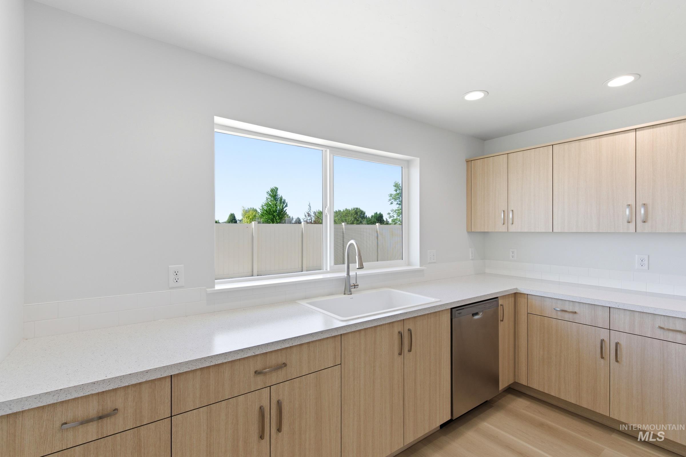 13677 Redway Court Caldwell, ID 83607 - Photo 6 of 35 Contemporary kitchen featuring light wood-finish cabinetry, white countertops, and recessed lighting