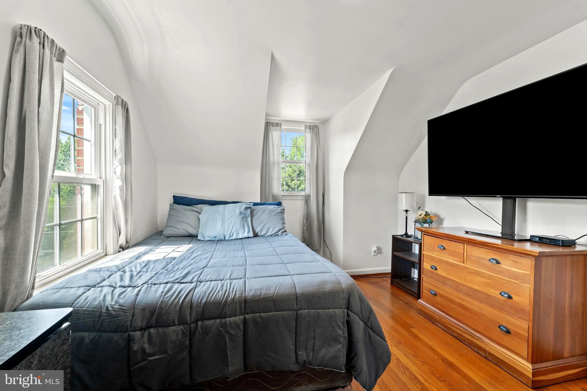 9307 Biltmore Drive Silver Spring, MD 20901 - Photo 12 of 33 a bedroom with a bed and a flat screen tv