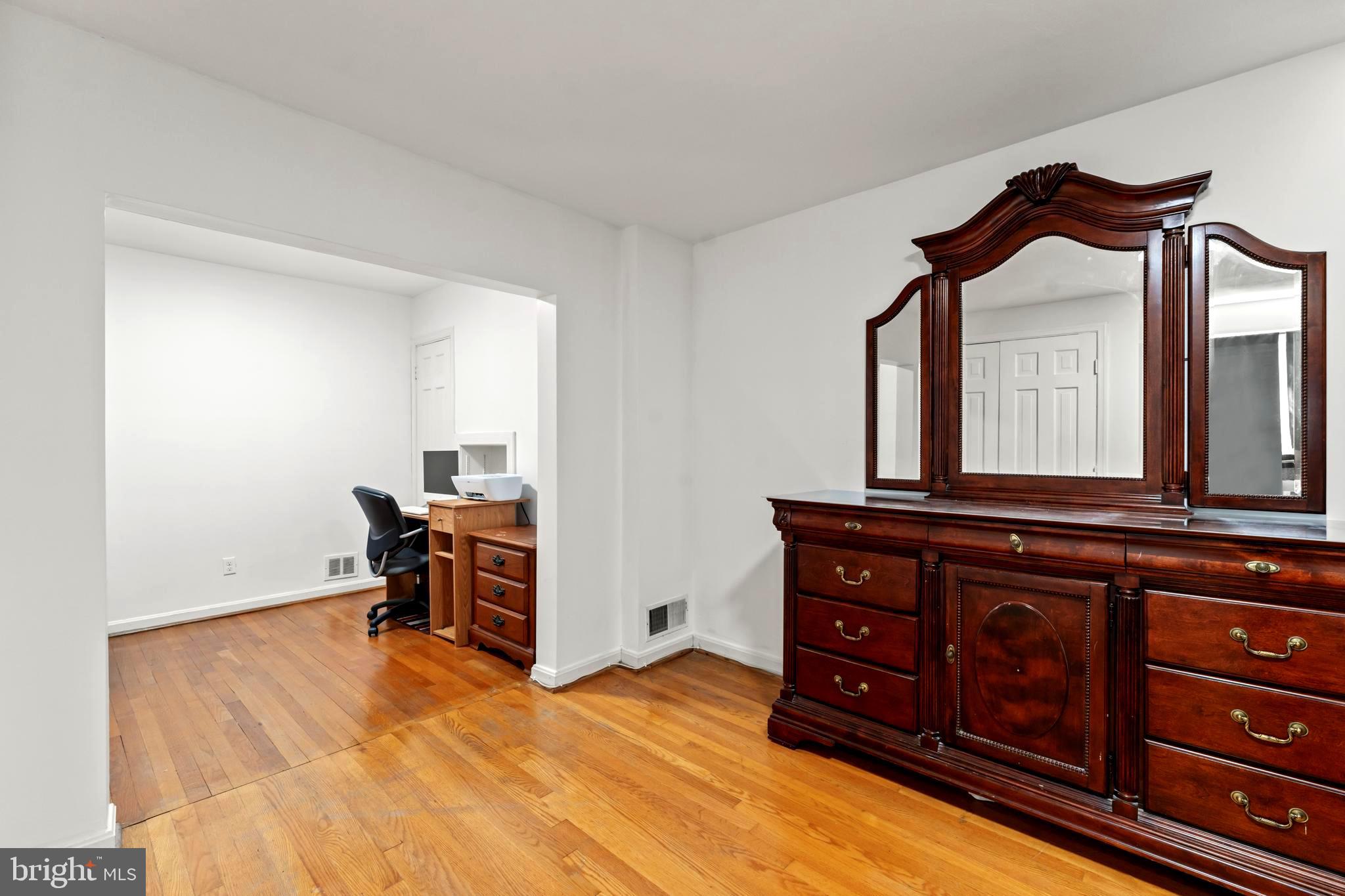 9307 Biltmore Drive Silver Spring, MD 20901 - Photo 15 of 33 a bedroom with a bed and furniture