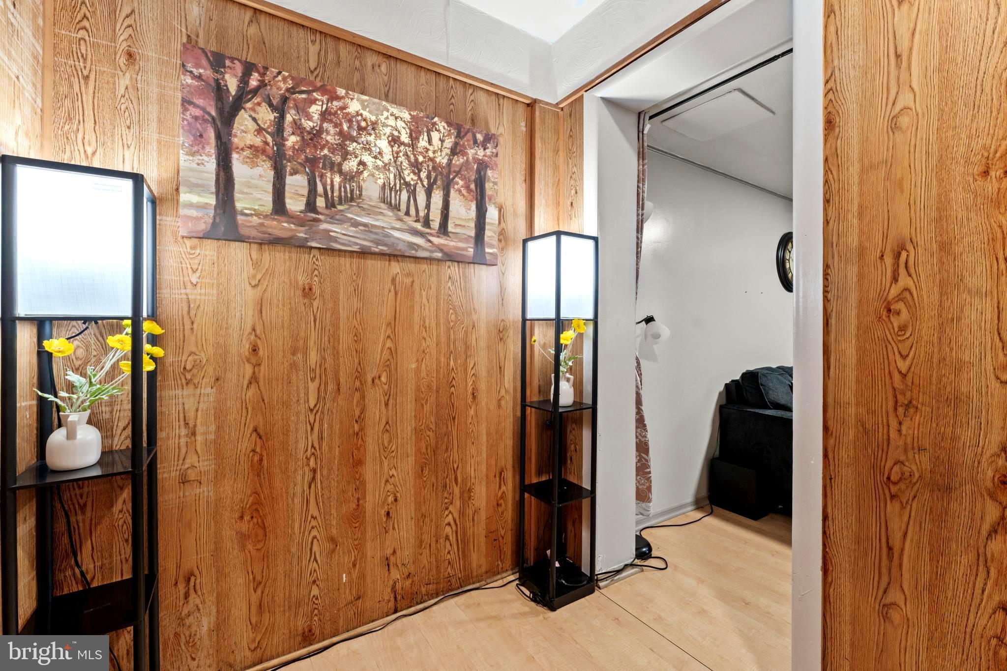 9307 Biltmore Drive Silver Spring, MD 20901 - Photo 17 of 33 a view of walk in closet with wooden walls