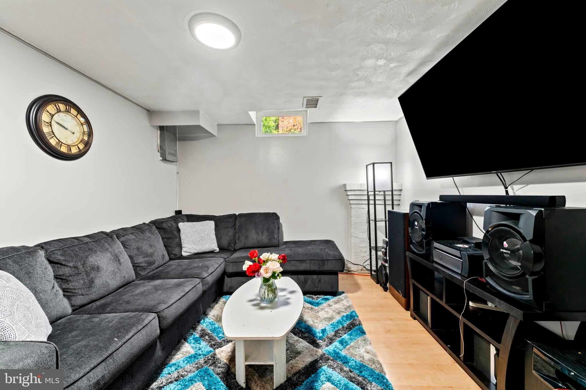 9307 Biltmore Drive Silver Spring, MD 20901 - Photo 18 of 33 a living room with furniture and a flat screen tv