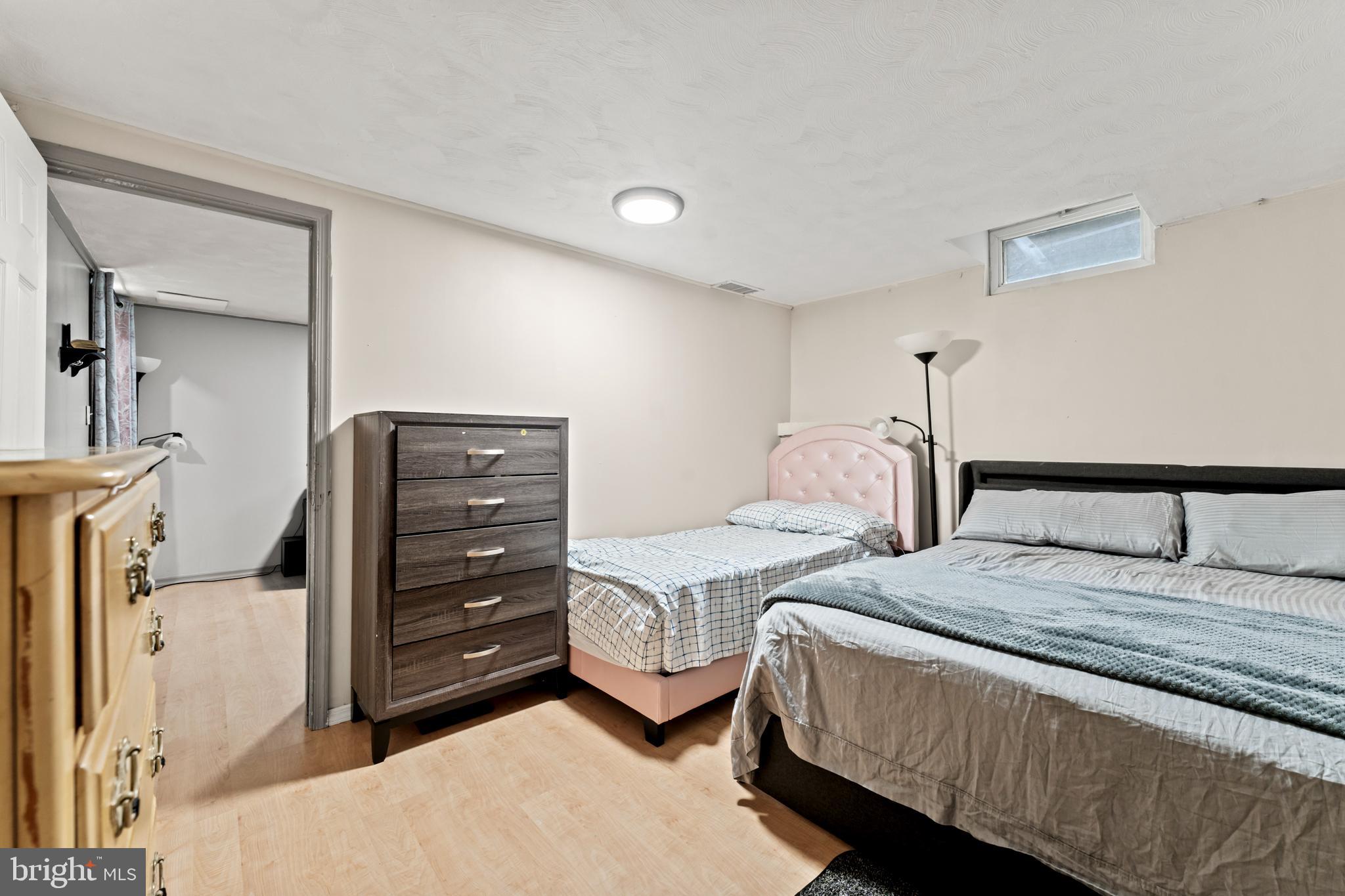 9307 Biltmore Drive Silver Spring, MD 20901 - Photo 19 of 33 a bedroom with a bed and a cabinets