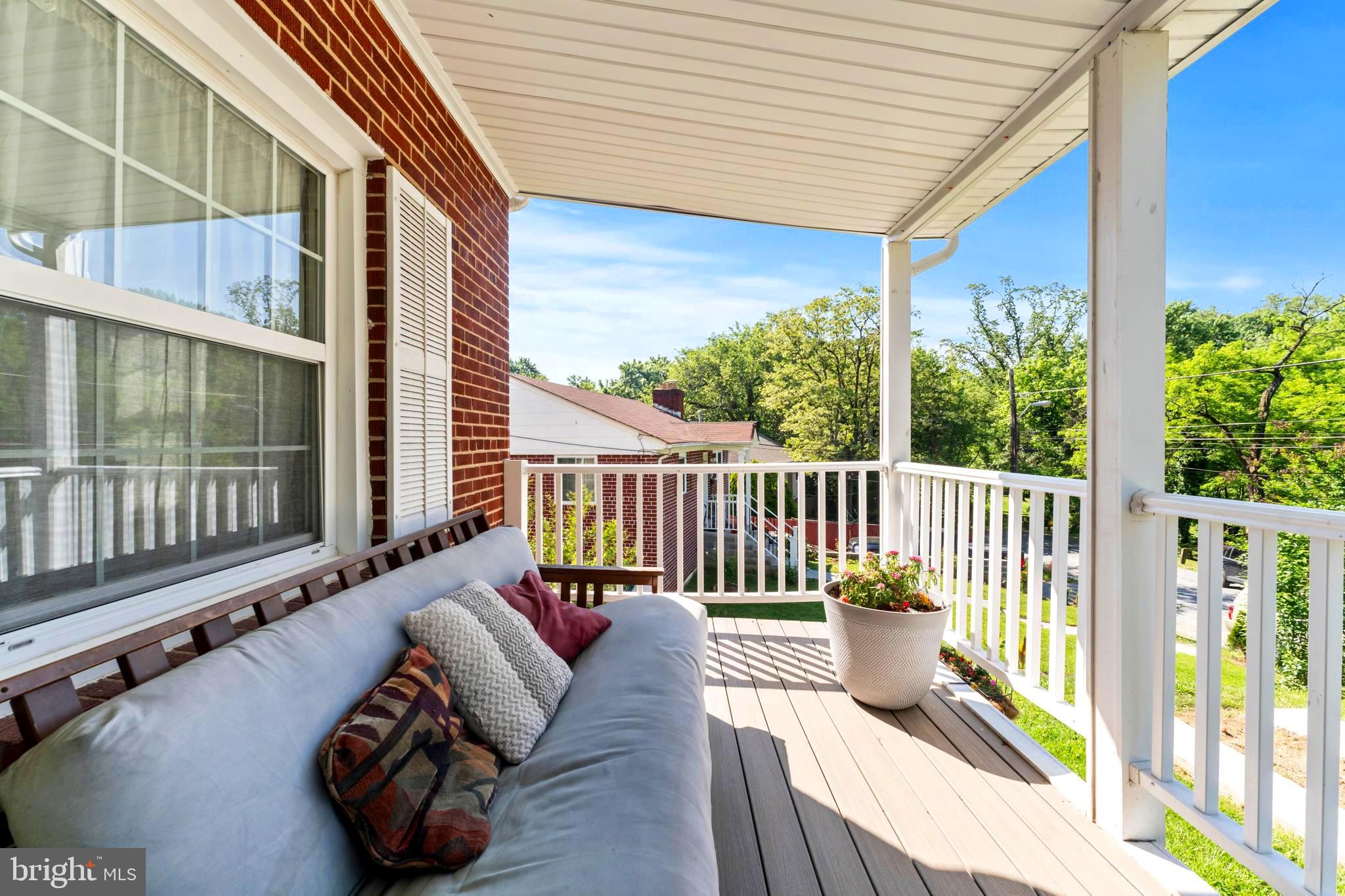 9307 Biltmore Drive Silver Spring, MD 20901 - Photo 2 of 33 a balcony with furniture and a potted plant
