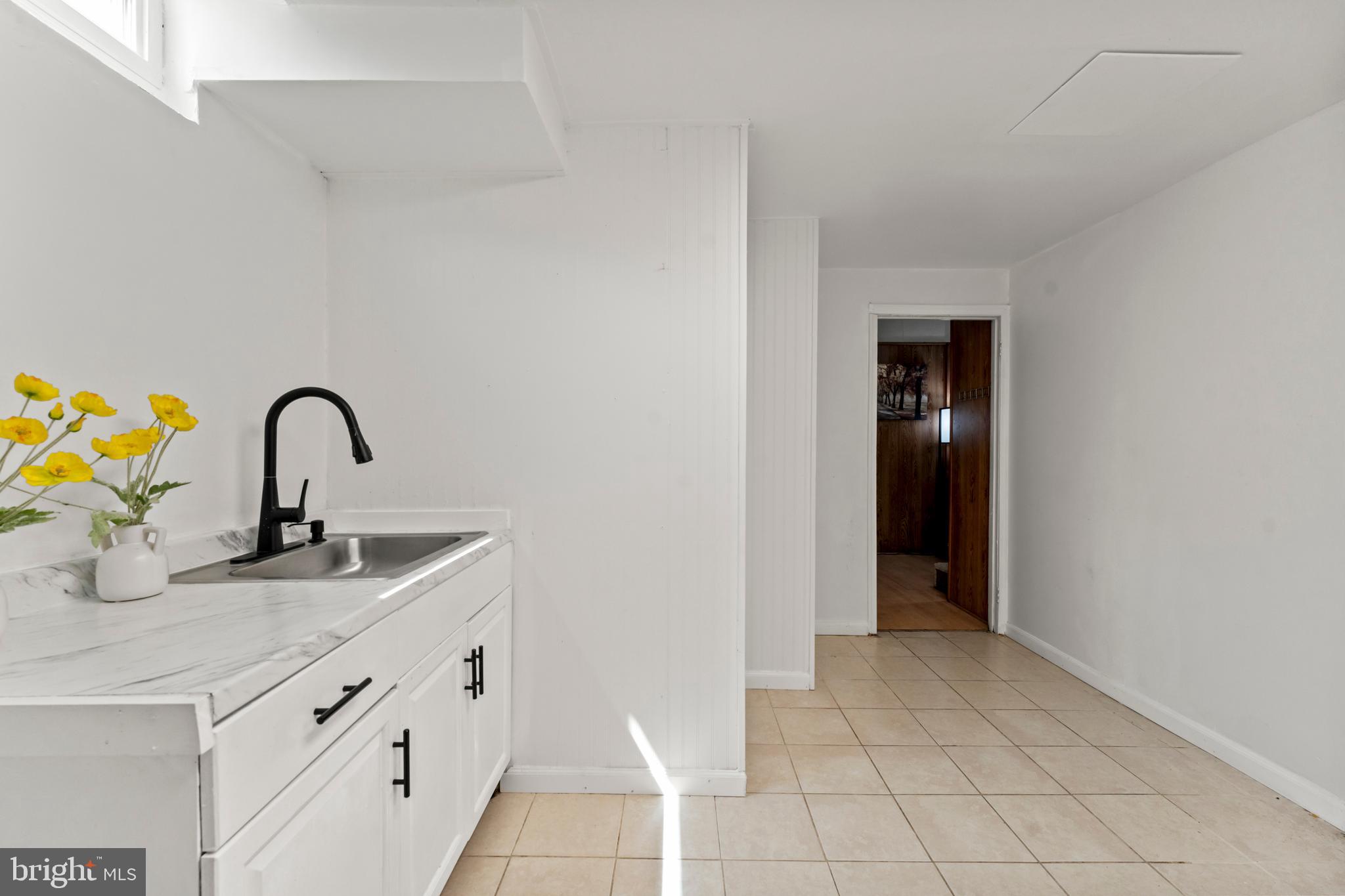 9307 Biltmore Drive Silver Spring, MD 20901 - Photo 21 of 33 a kitchen with granite countertop a sink and a stove