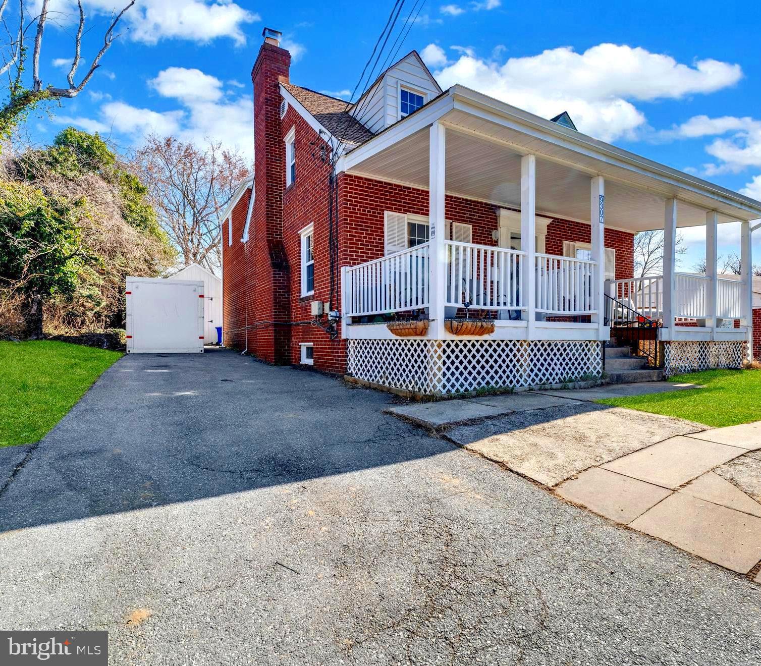 9307 Biltmore Drive Silver Spring, MD 20901 - Photo 28 of 33 a front view of a house with a yard